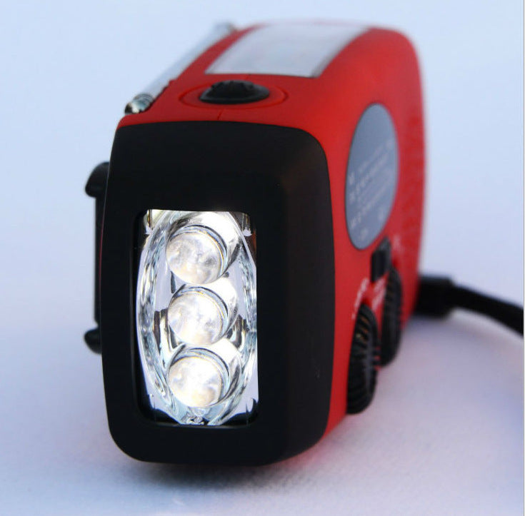 Solar hand crank radio flashlight